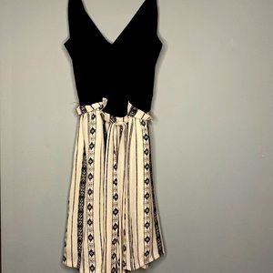 A Lilly Rose Romper with a belt. The color is black and white. Size Medium